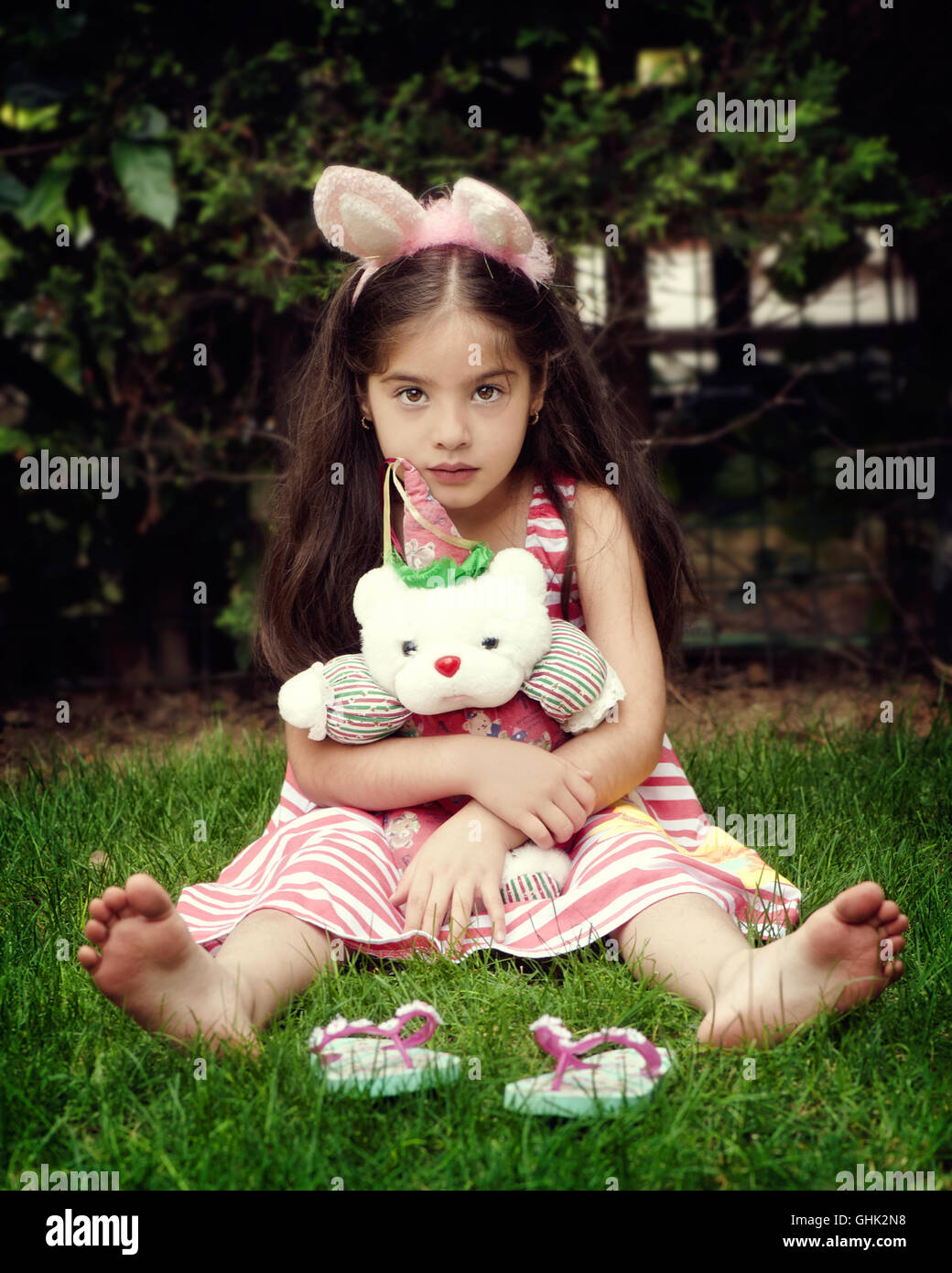 Sad girl sitting grass hi-res stock photography and images - Alamy