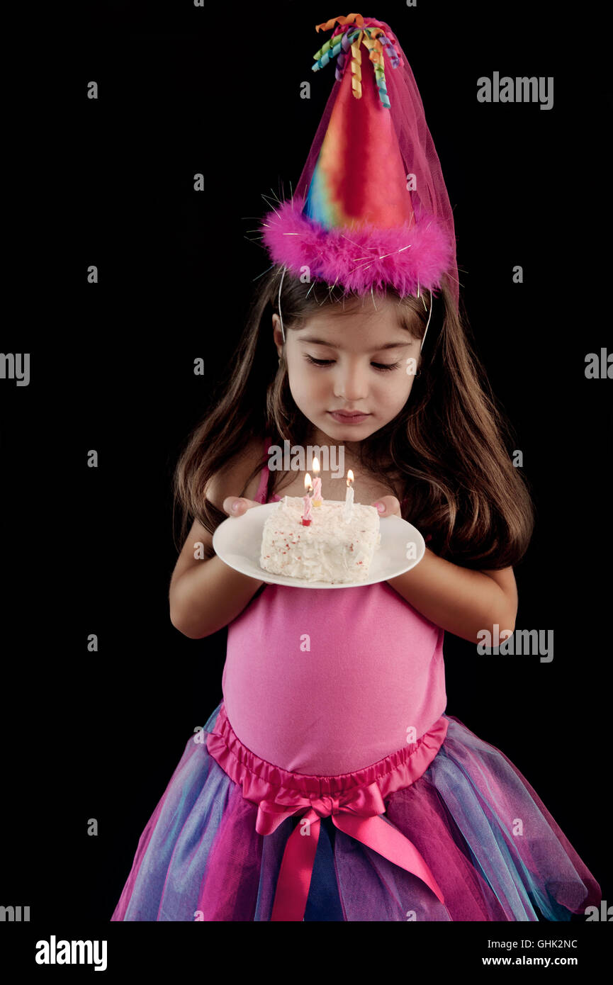 Little girl holding birthday cake Stock Photo Alamy