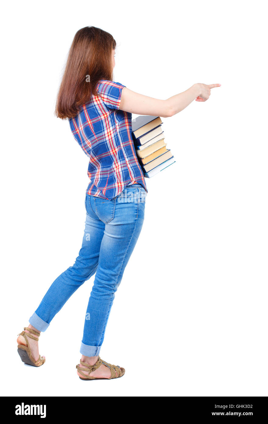 Girl carries a heavy pile of books. back view Stock Photo - Alamy