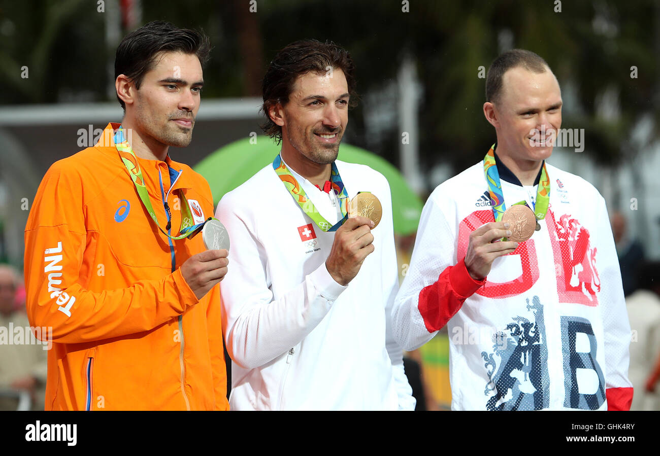 Great Britain's Chris Froome (right) with his bronze medal alongside gold medal Switzerland's Fabian Cancellara (centre) and silver medal winner Netherland's Tom Dumoulin during the men's road cyling individual time trials on the fifth day of the Rio Olympic Games, Brazil. Stock Photo
