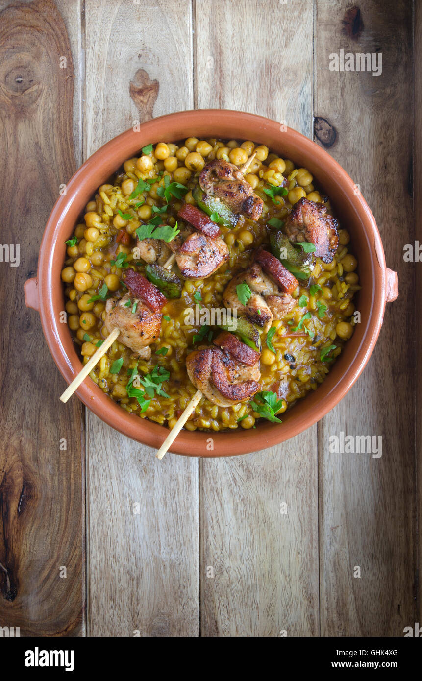 Chicken and chorizo skewers with paella-style rice Stock Photo