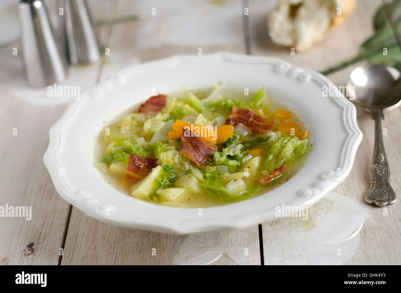 Potato and savoy cabbage soup with bacon Stock Photo