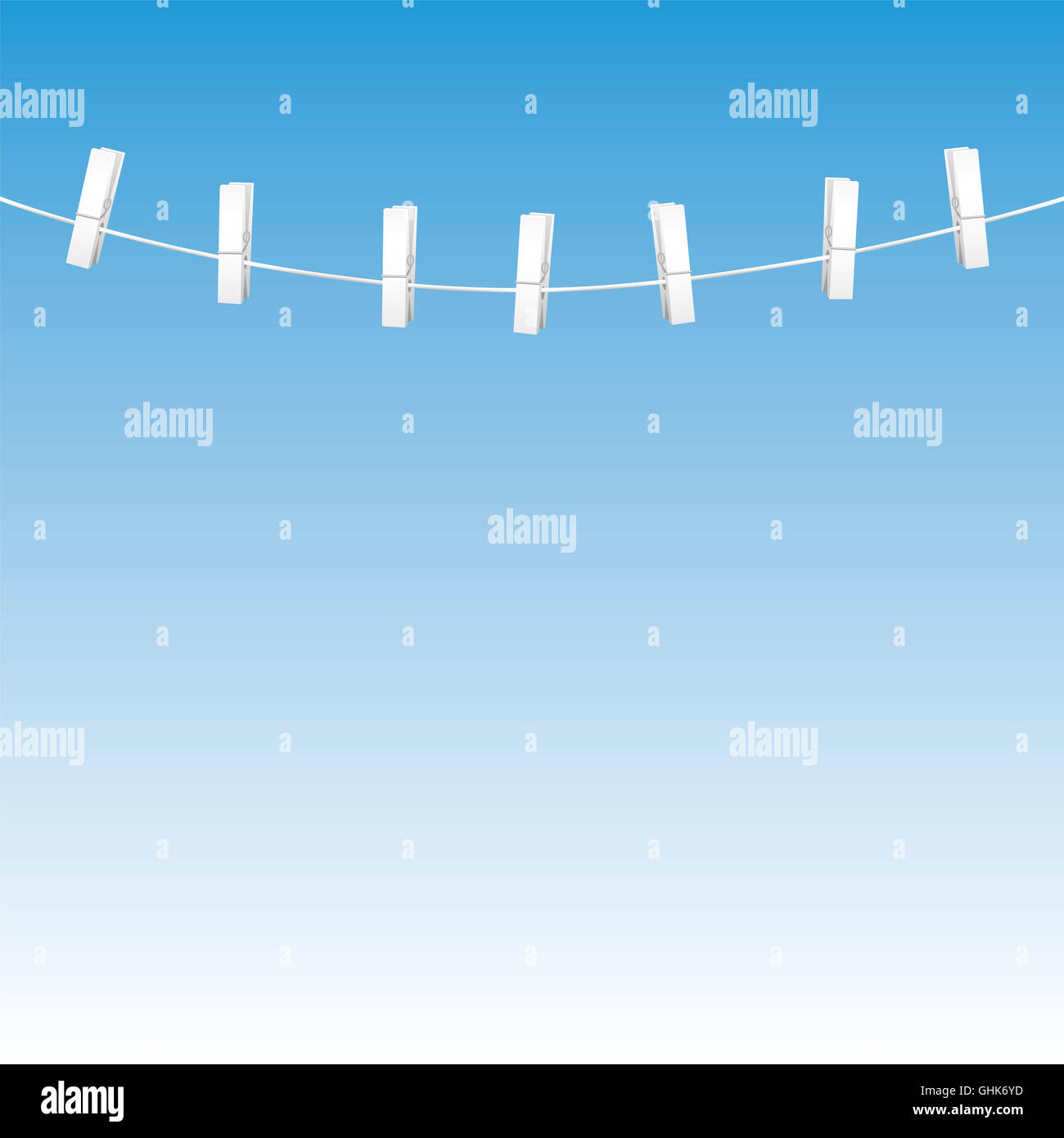 Clothes line rope with seven white clothes pins - blue sky background. Stock Photo