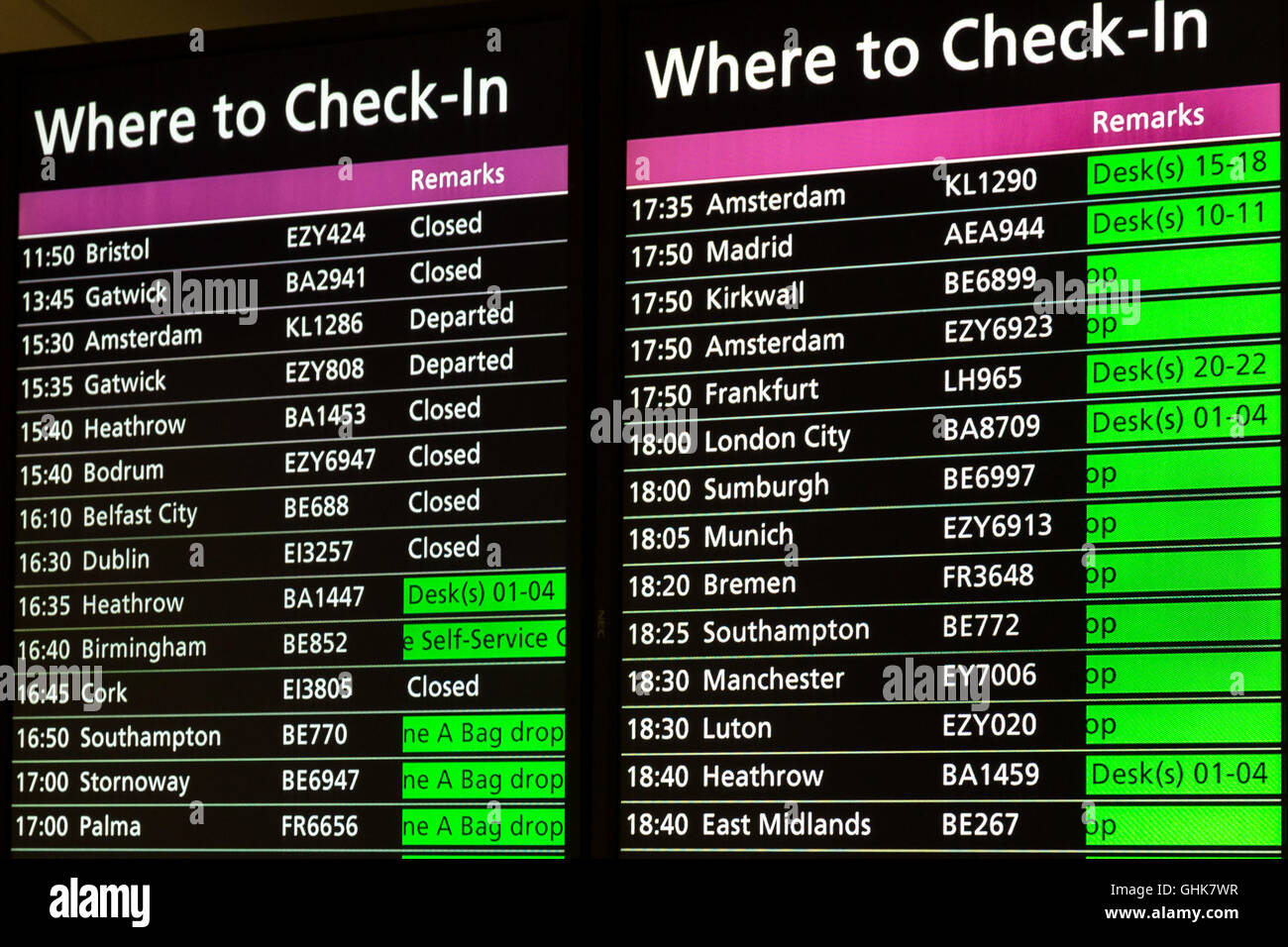 Airport board showing departures and gates Stock Photo
