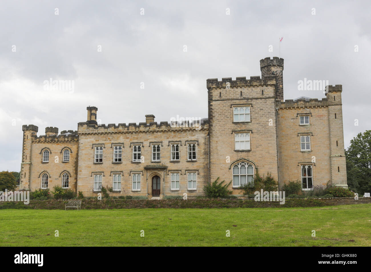 Dark clouds over Chiddingstone Castle in the Kent village of Chiddingstone England. Stock Photo