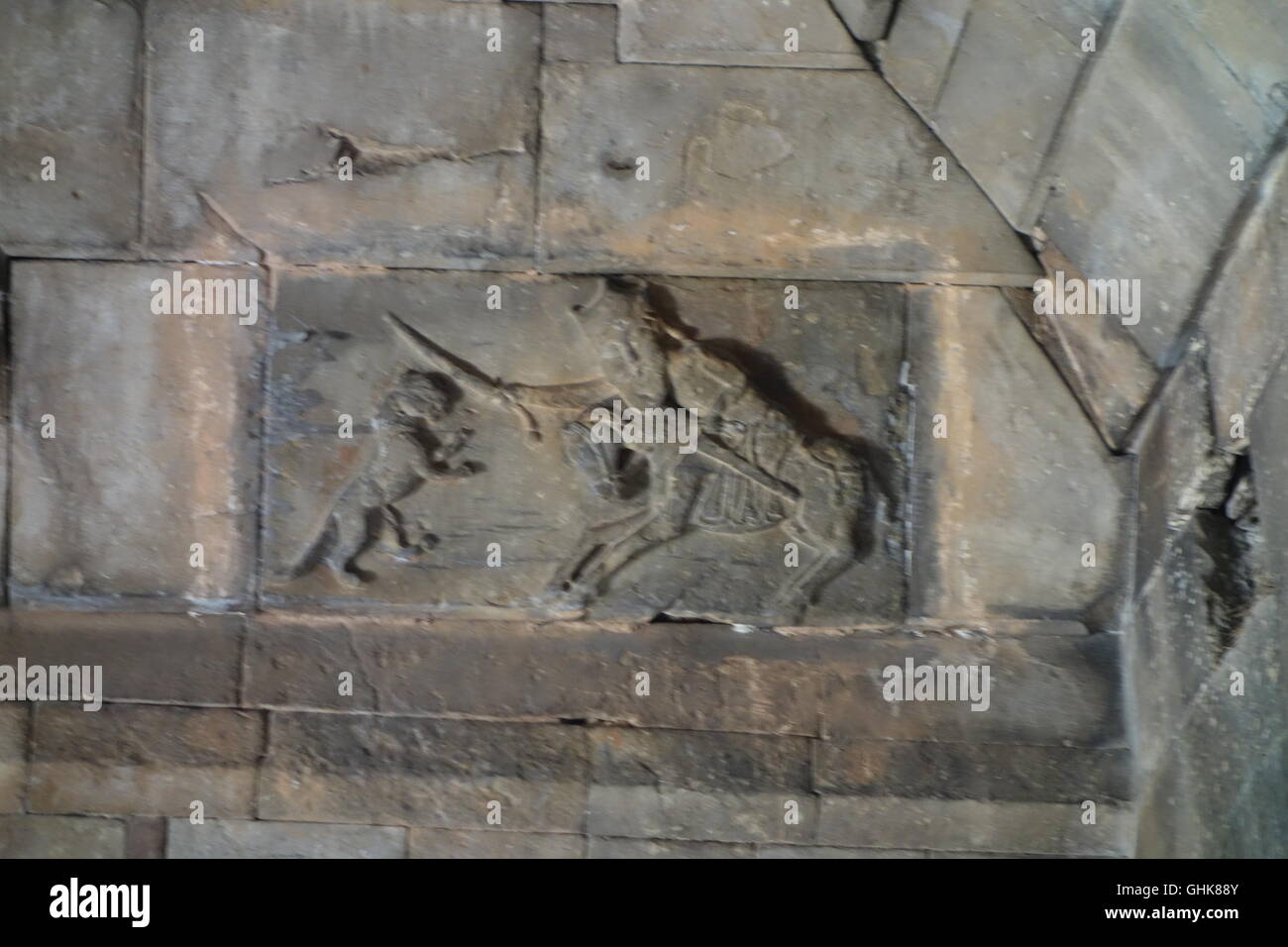 Noravank Monastery carving showing mounted horseman, prince or saint, fighting off lion. Armenian late 13, early 14th century Stock Photo