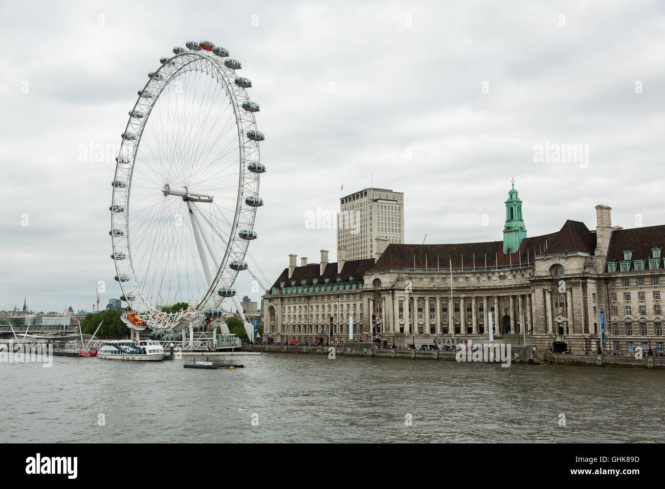 The London Eye and County hall on the South Bank of the River Thames on ...