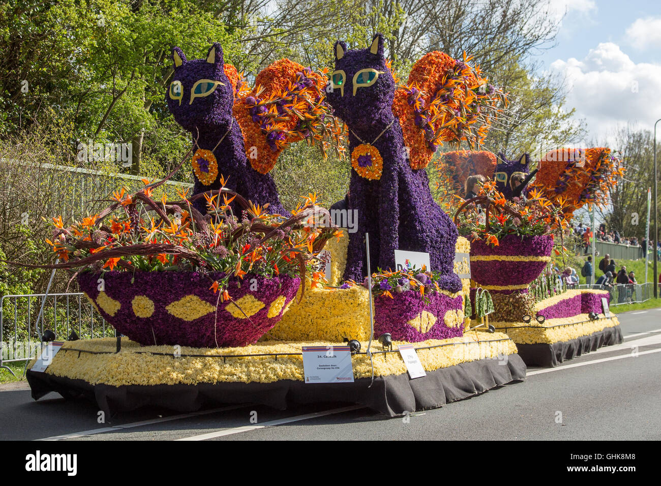 Platform in the form of two cats follows the route of the traditional flowers parade Stock Photo