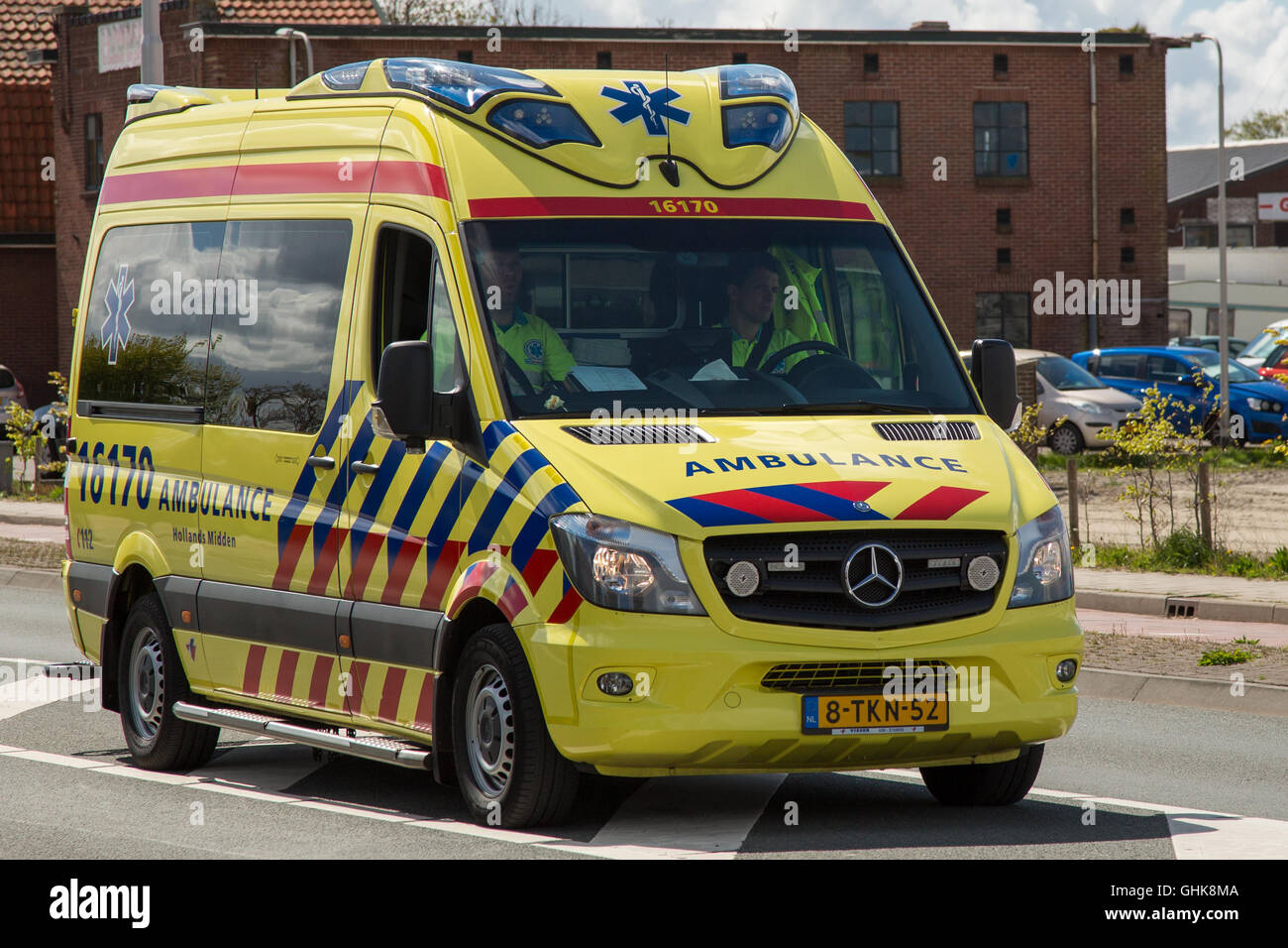 Lisse, NETHERLANDS - 23 APRIL 2016:  slowly driving dutch ambulance vehicle Stock Photo