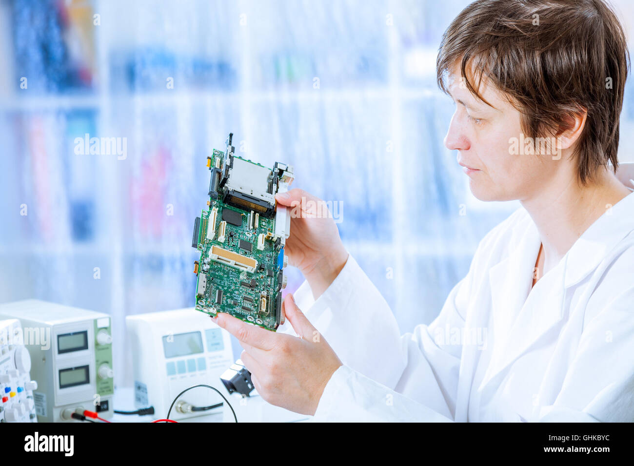 Woman repair electronics device Stock Photo Alamy
