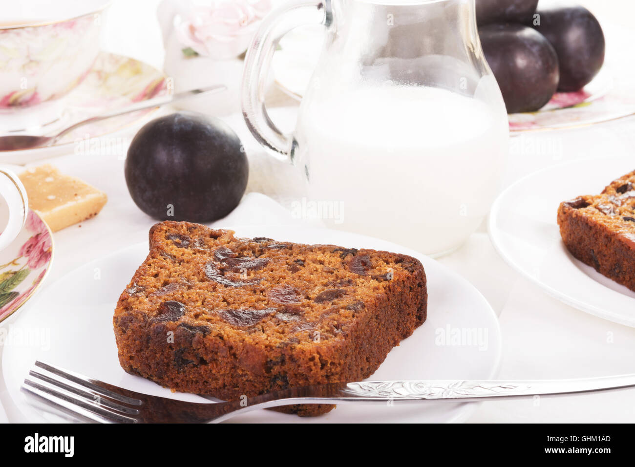 Tea served with traditional British fruit cake. Close-up Stock Photo