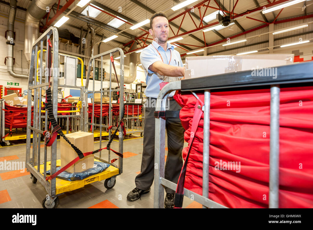 Postal workers sorting the mail in a sorting office in southern England Stock Photo Alamy