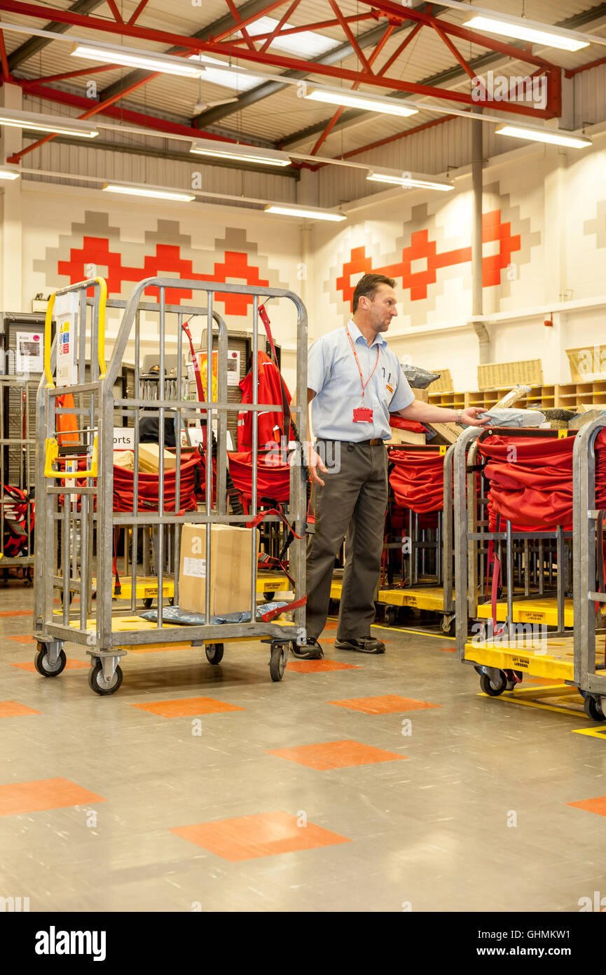 Postal workers sorting the mail in a sorting office in southern England Stock Photo Alamy