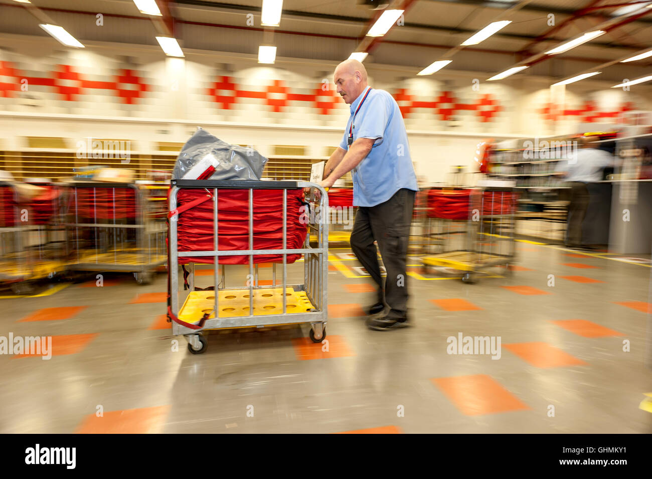 Postal workers sorting the mail in a sorting office in southern England