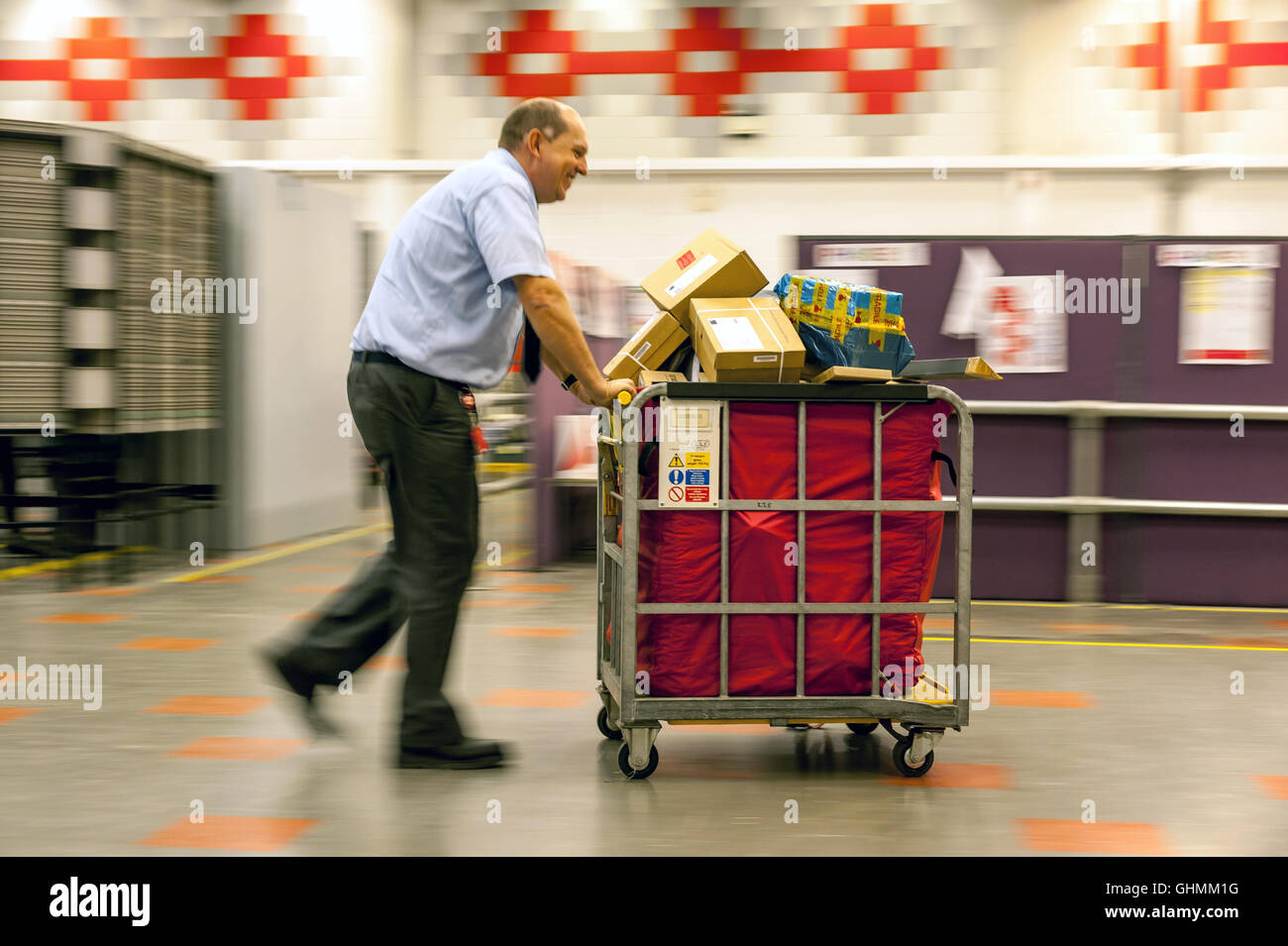 Postal workers sorting the mail in a sorting office in southern England
