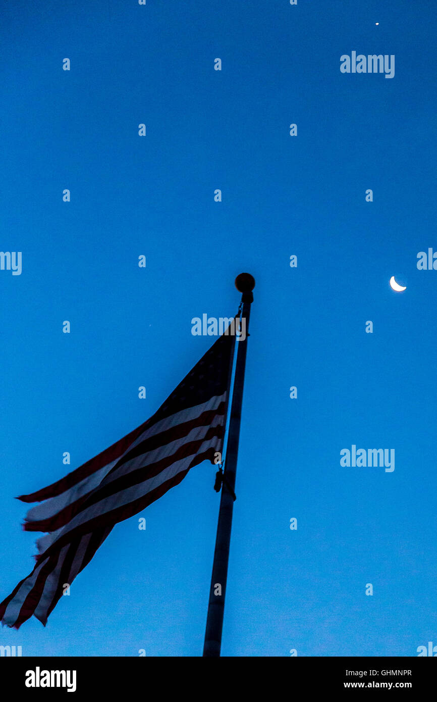 U.S. Flag with waning crescent moon and bright star Stock Photo
