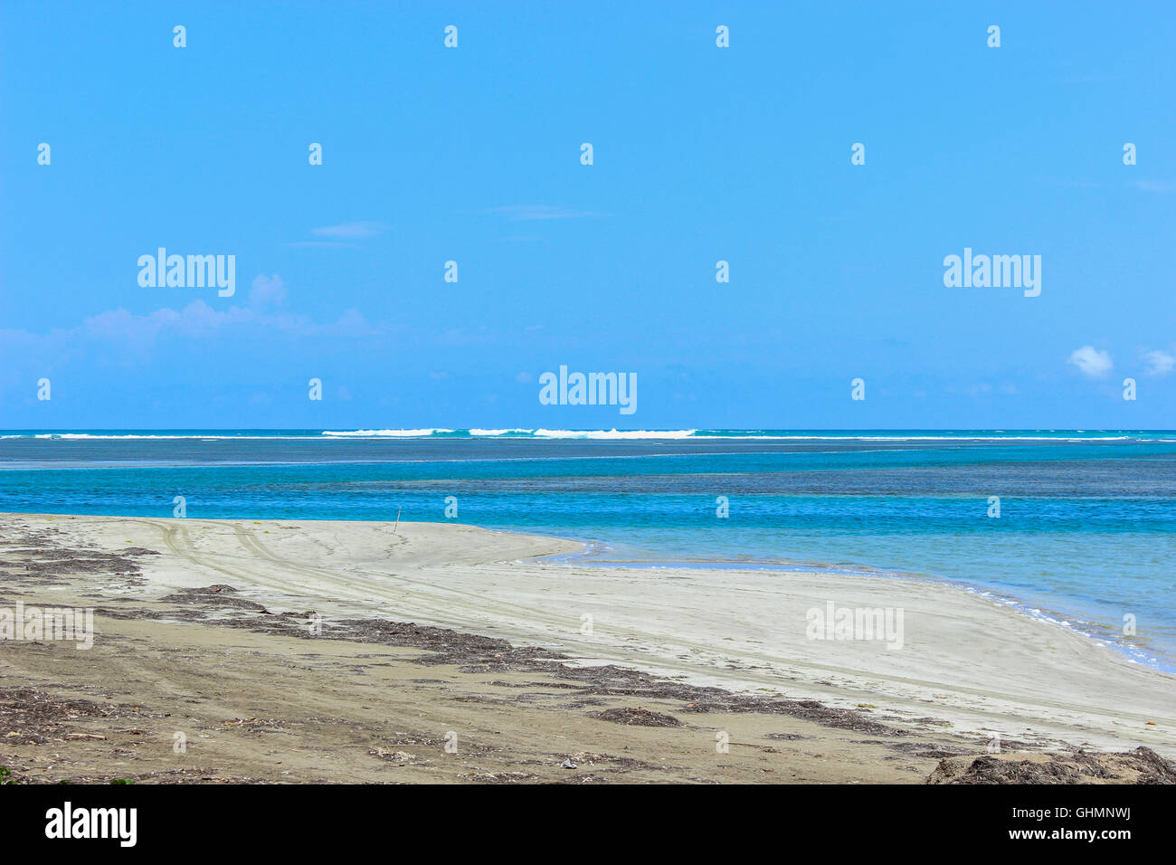 Blue Sky on Sandy Beach and Breaking Sea Wave Stock Photo - Alamy