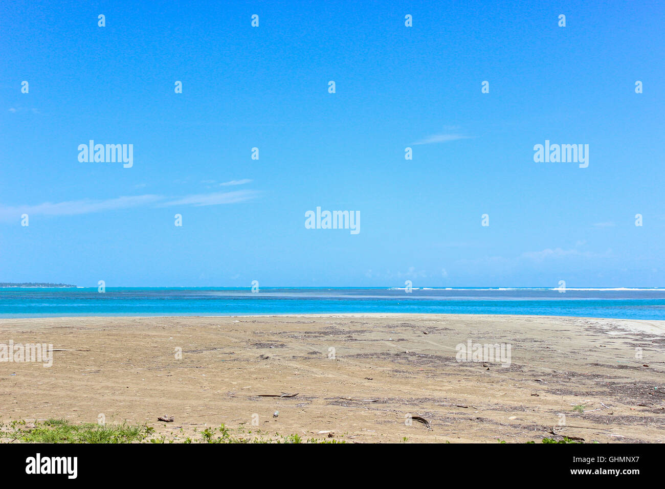 Bright Blue Sky on Sandy Beach and Sea Stock Photo - Alamy