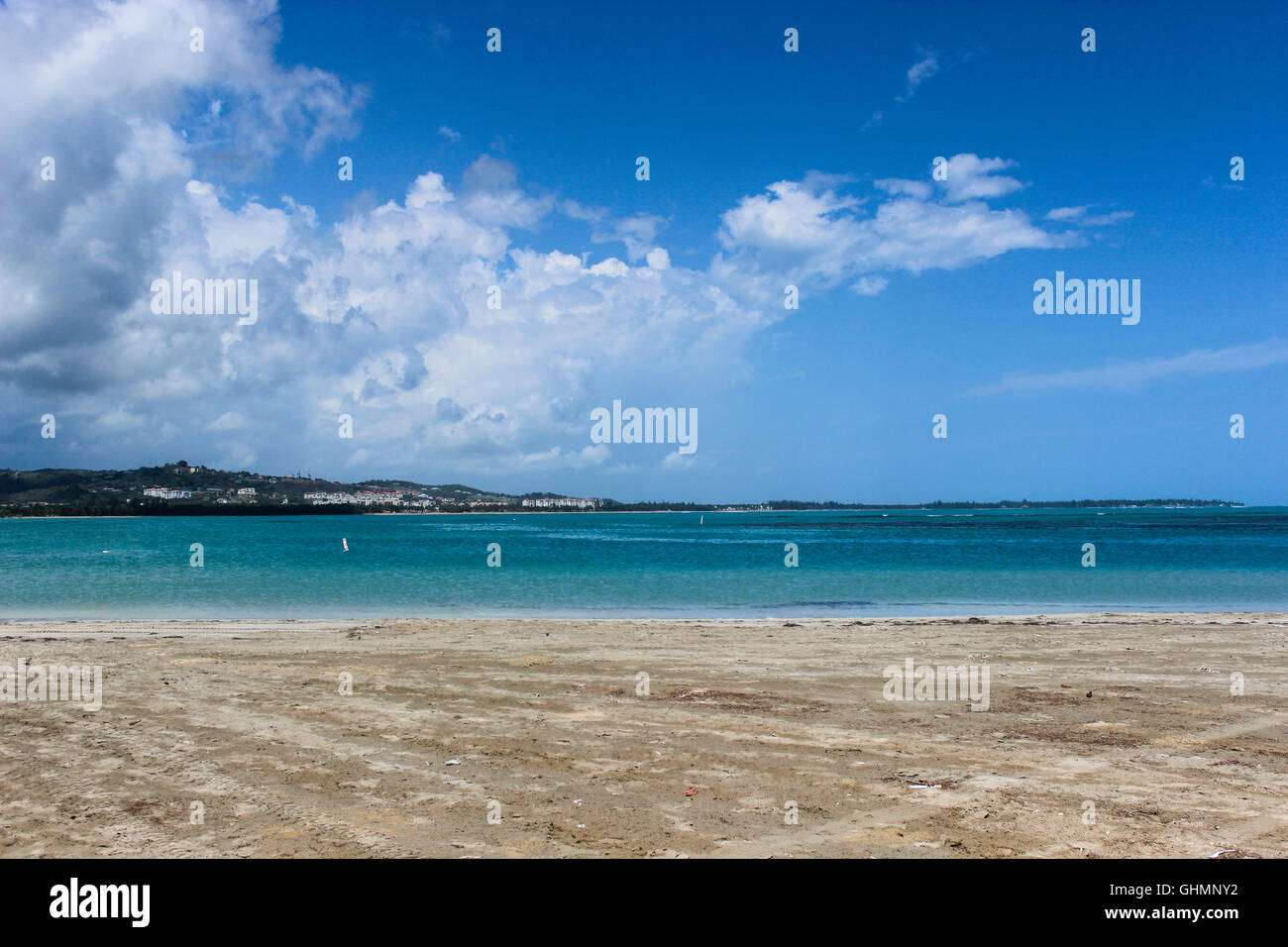Blue Sky on Sandy Beach and Sea Stock Photo - Alamy