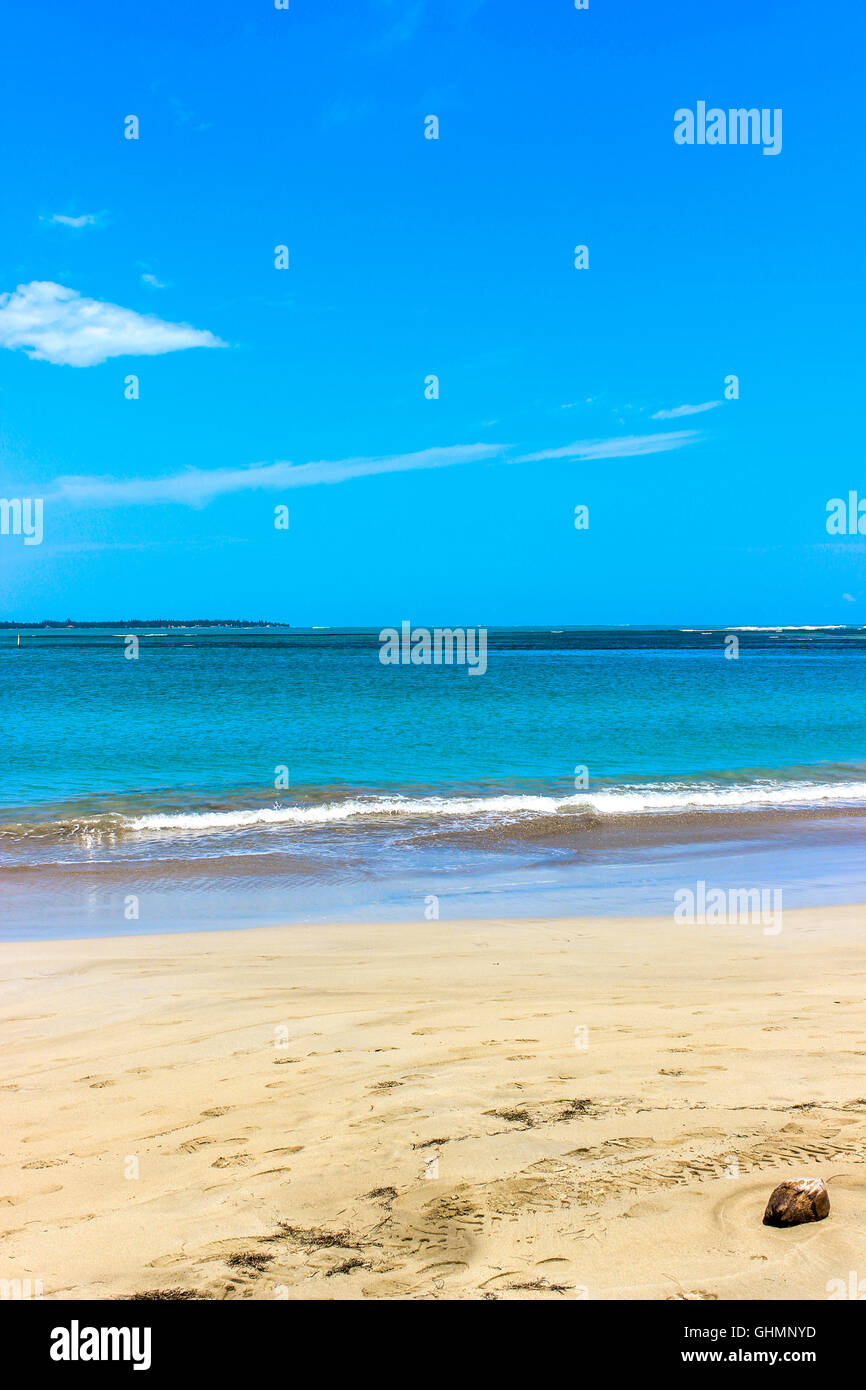 Bright Blue Sky on Sandy Beach and Breaking Sea Wave Stock Photo - Alamy
