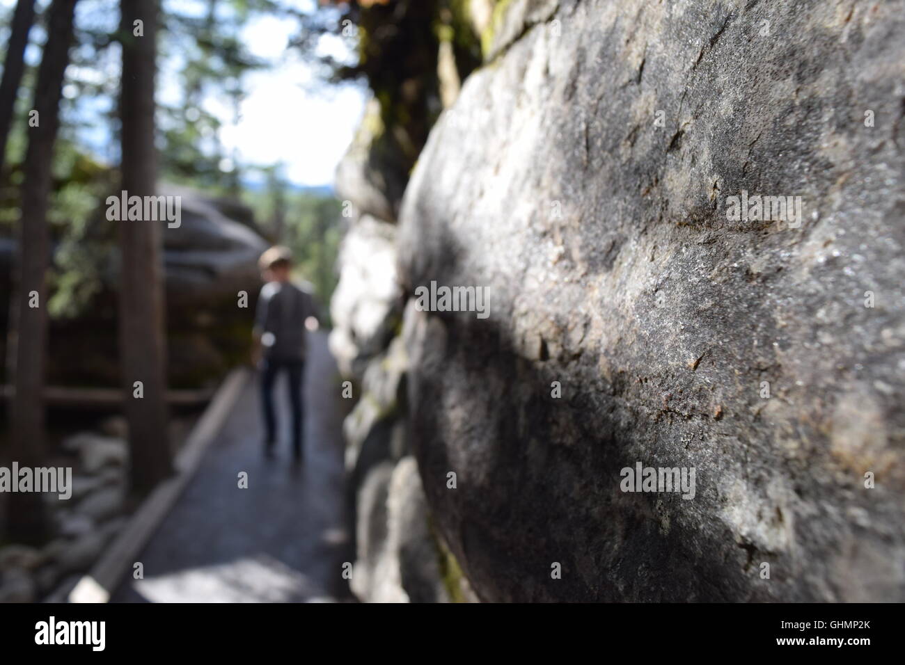 Boy walking down stone path Stock Photo