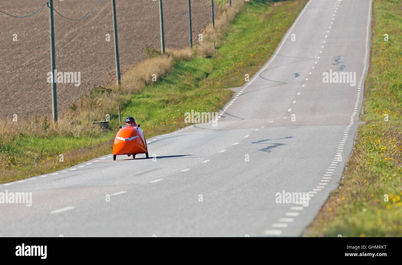 MORKO SWEDEN, September 18, 2014, biker on tour in a velomobile . A man on a bike ride in an unusual vehicle. Stock Photo