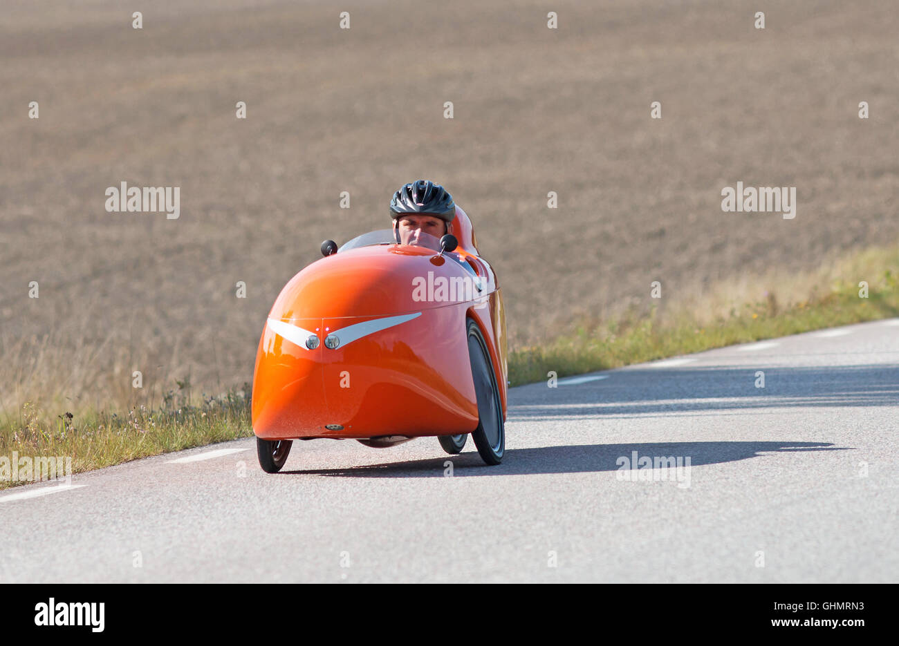 MÖRKÖ SWEDEN, September 18, 2014, biker on tour in a velomobile. A man on a bike ride in an unusual vehicle. Stock Photo