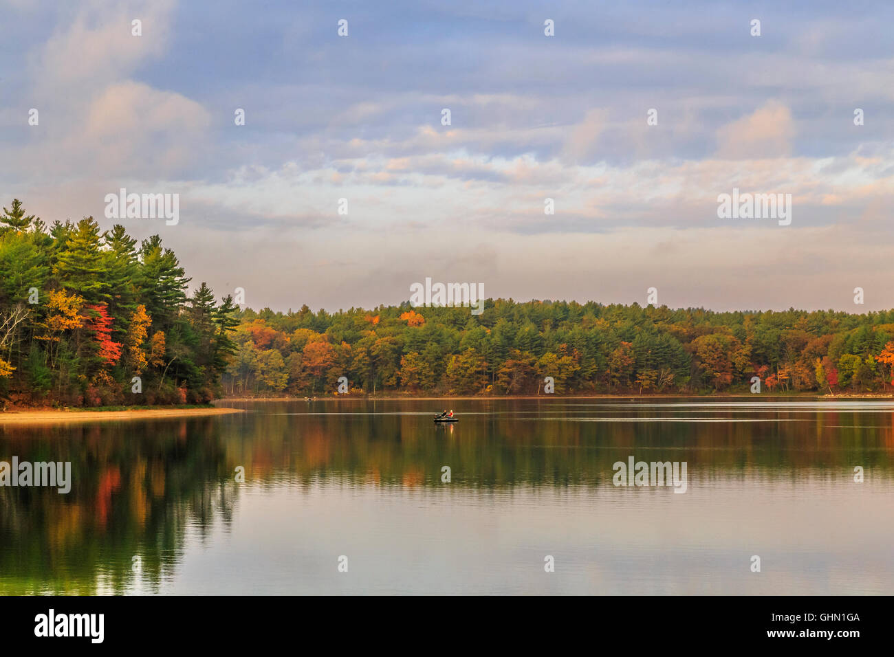 Fall Pond Reflections Walden Pond sunrise during fall with autumn color tress and pond ...