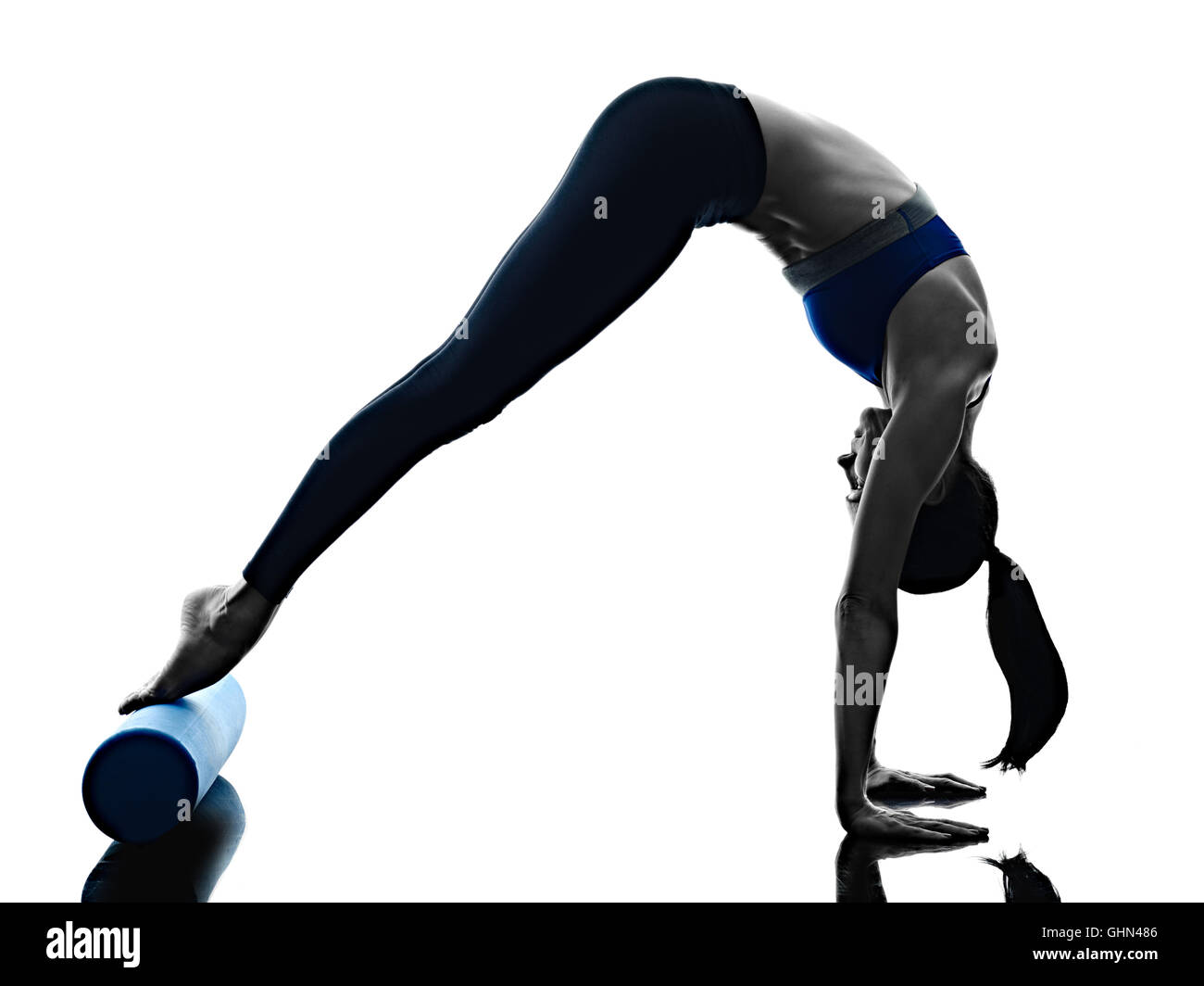 one caucasian woman exercising pilates roller exercises fitness in  silhouette isolated on white backgound Stock Photo - Alamy