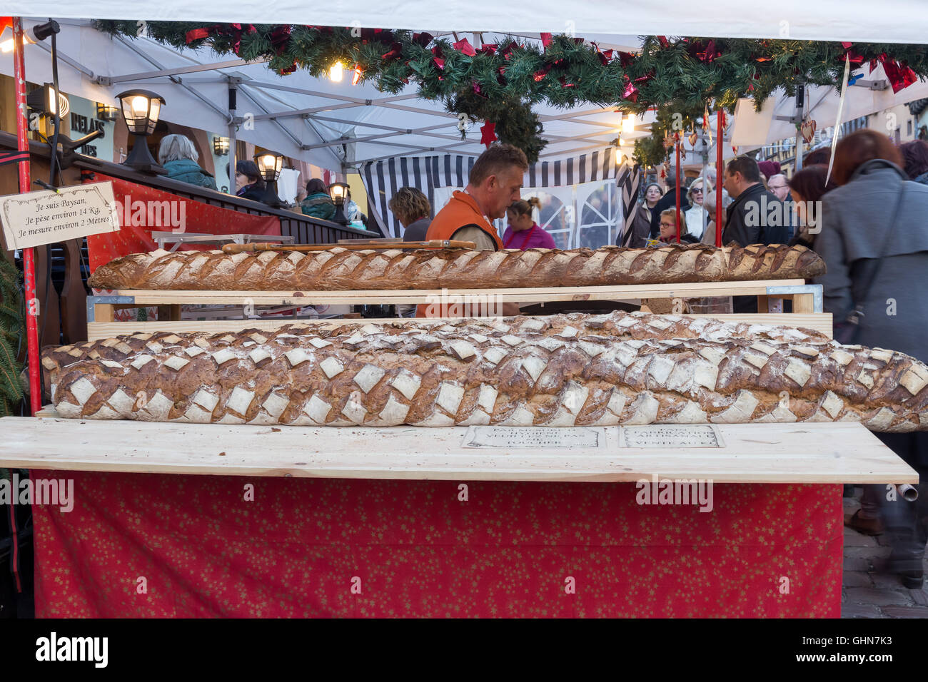 The huge loaf of bread. Christmas Market in picturesque Riquewihr
