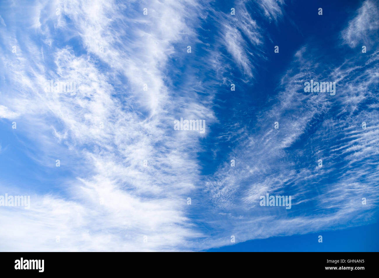 Bizarre cirrus and stratus clouds covering blue sky Stock Photo - Alamy