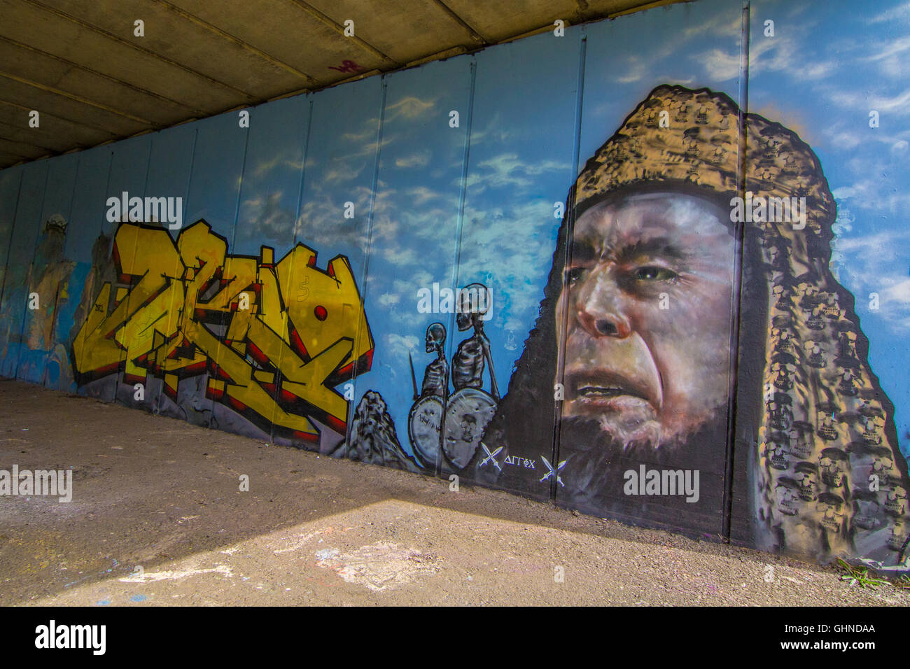 A wide angle shot of a fantastical graffiti scene, on a blue background. Stock Photo