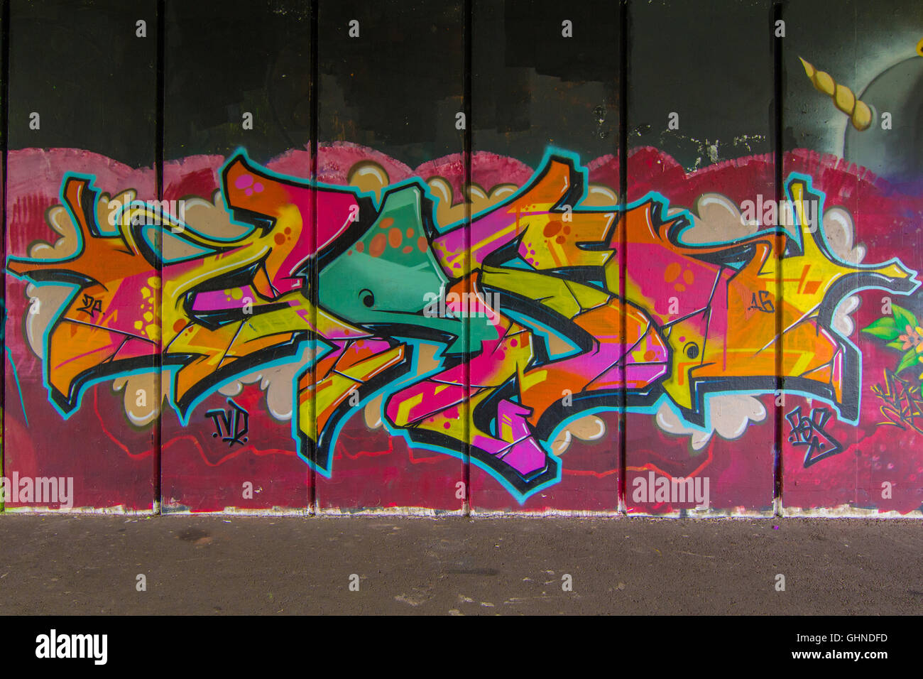 Vibrant Wild Style graffiti piece sprayed on concrete underpass Stock Photo