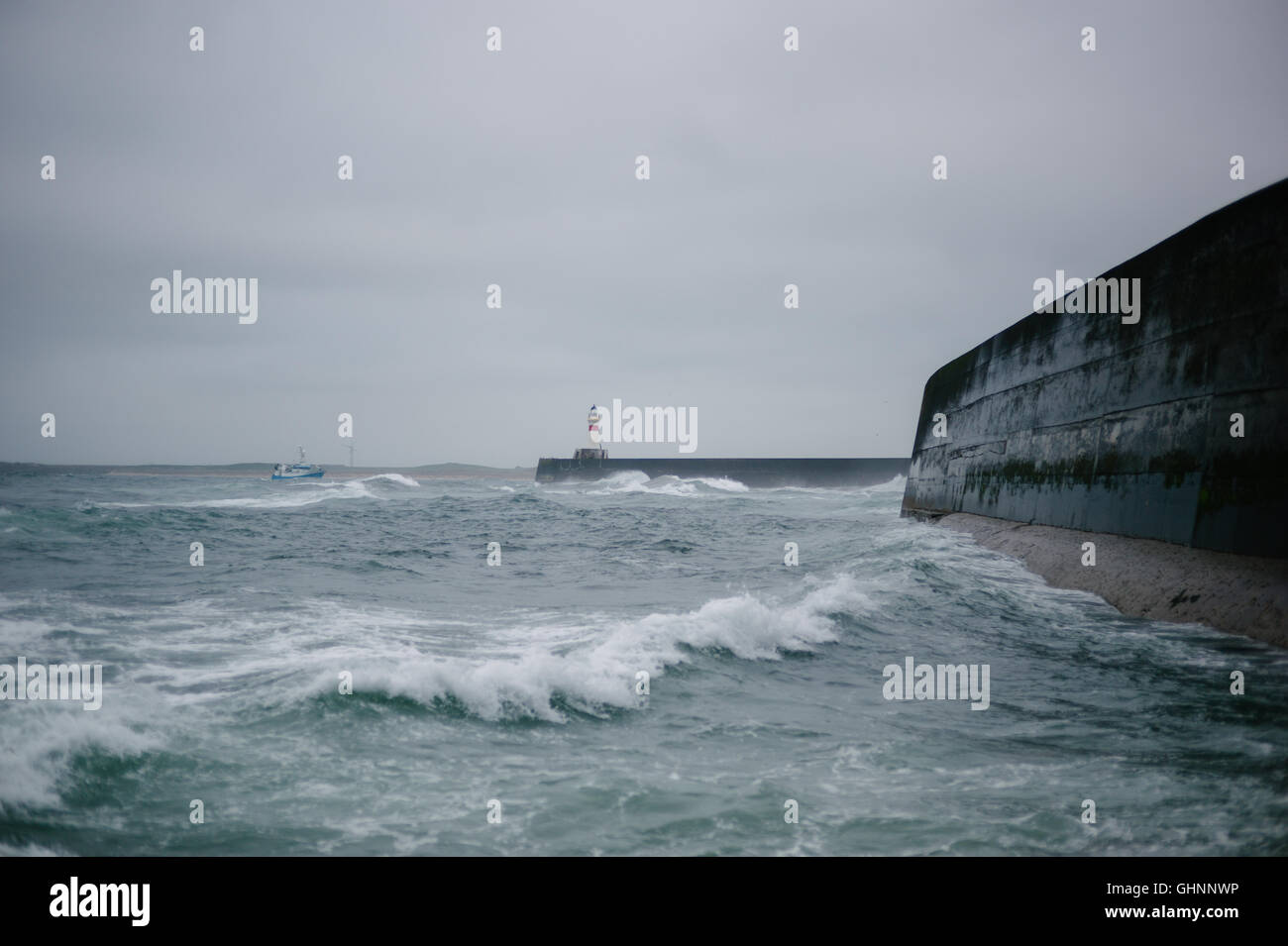 Fishing boat coming home to Fraserburgh in stormy weather Stock Photo