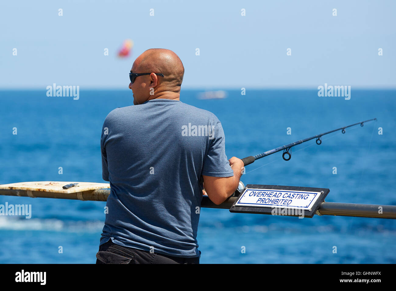 Rear view bald man fishing hires stock photography and images Alamy