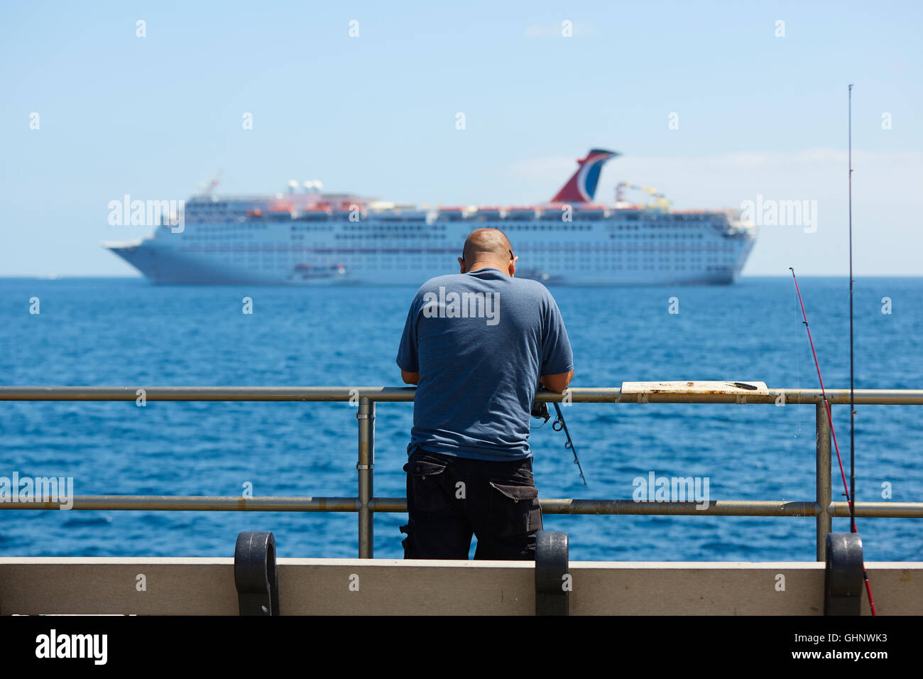 Man Fishing From The Jetty In Avalon, Catalina Island, California. The