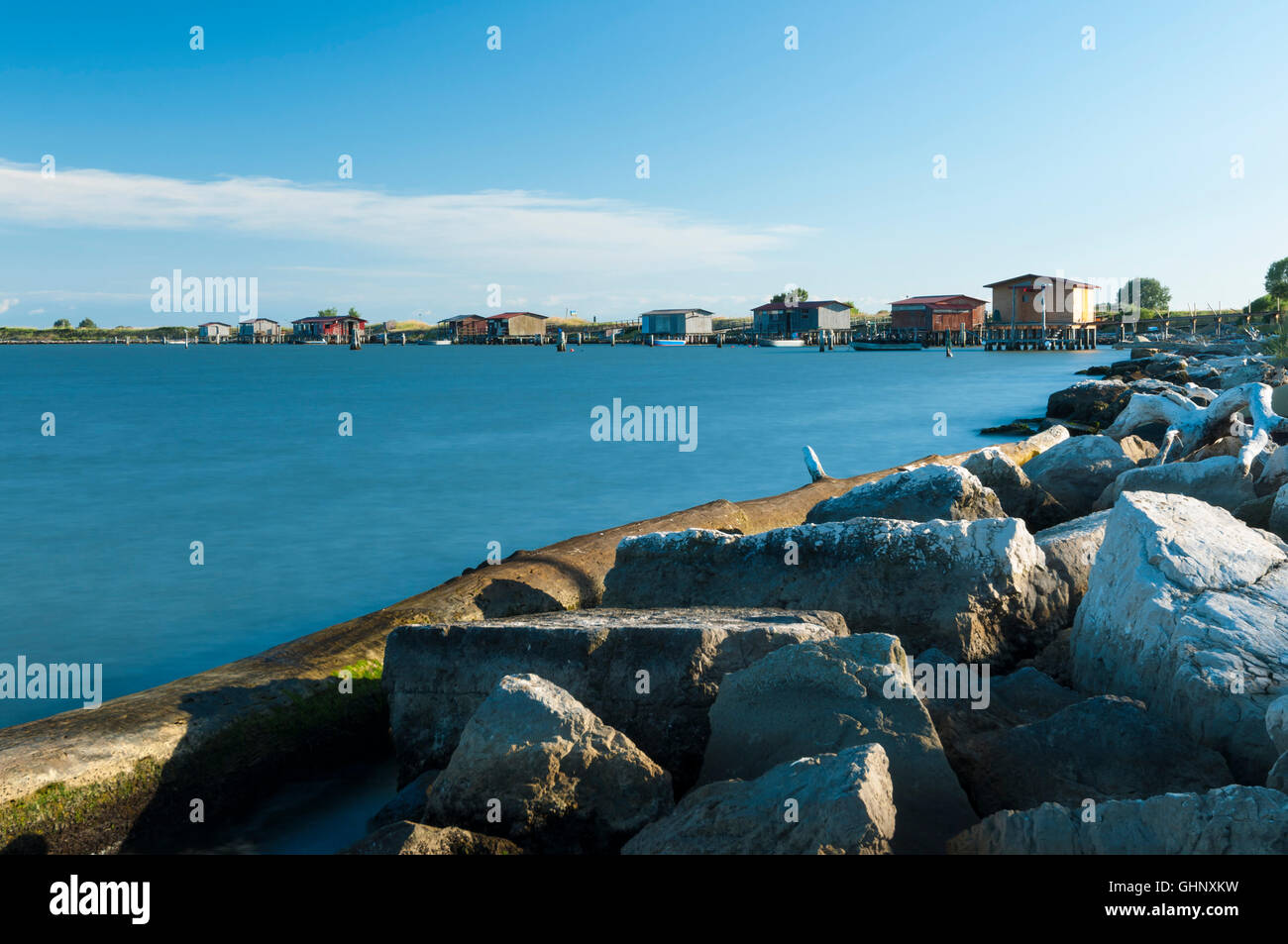 View of fishing hut and boats at the Scardovari Lagoon, Po river estuary, Rovigo, Italy Stock Photo