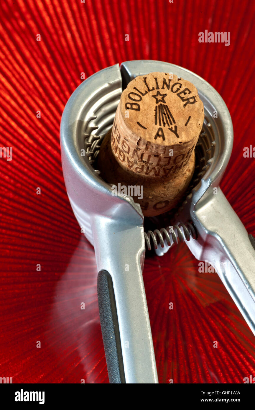 Sommelier Bollinger Champagne cork gripper opener on luxury table Stock Photo