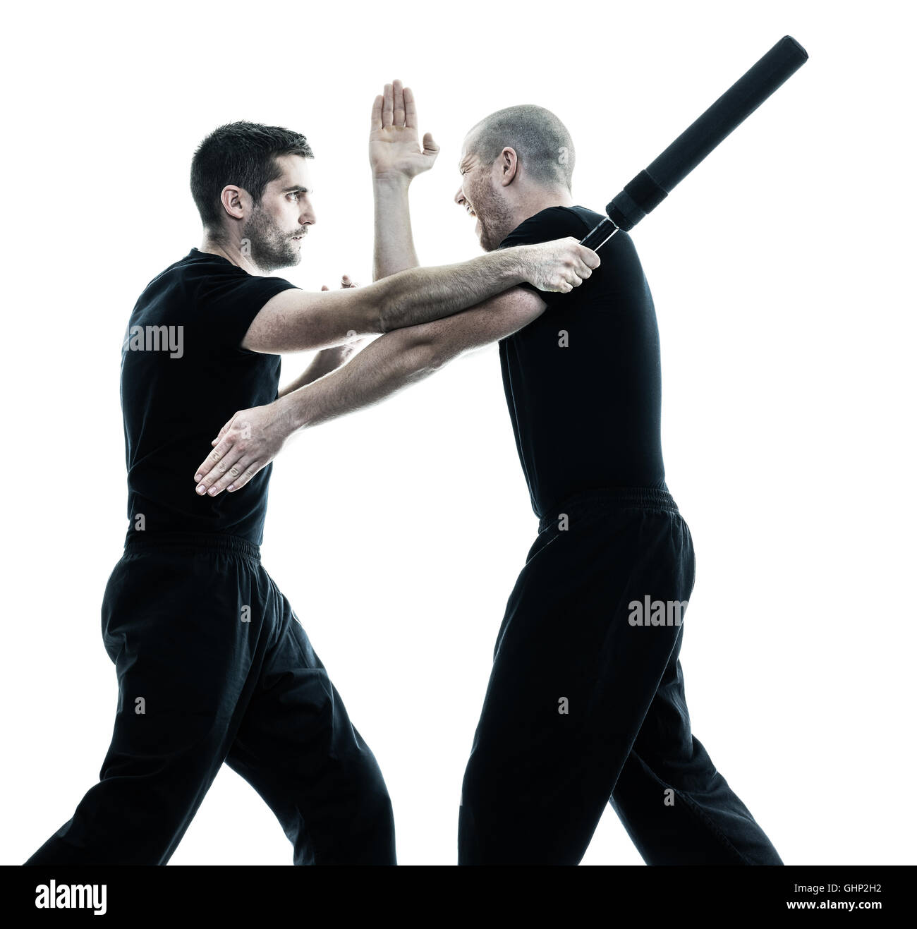 two caucasian men krav maga fighters fighting isolated silhouette on