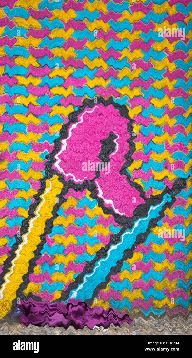 waves abstract of colourful mural graffiti of safety pin on wall with purple material on ground at Shoreditch, London Stock Photo