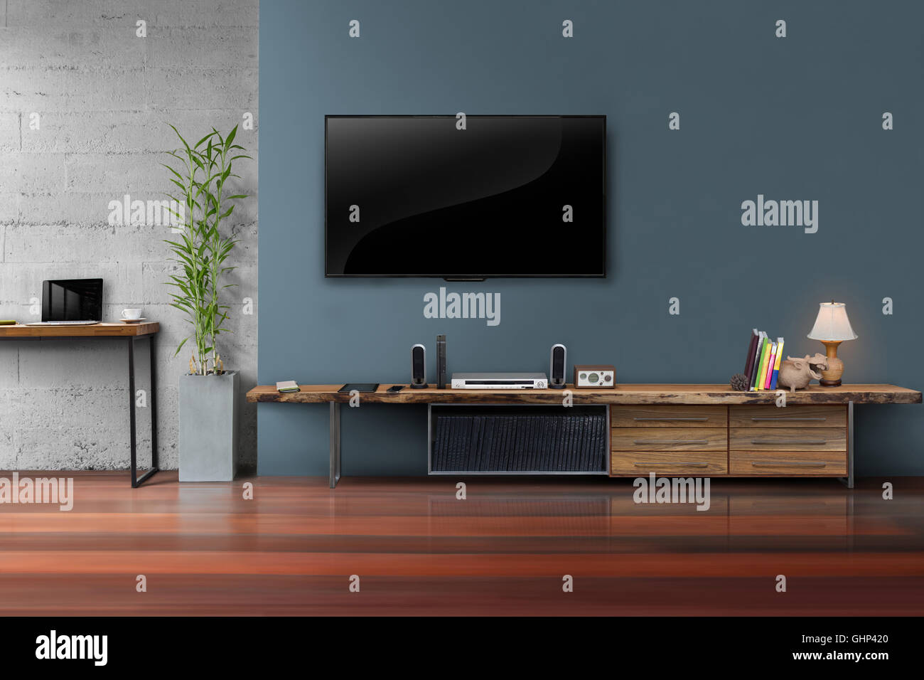Living room led tv on dark blue wall with wooden table and plant in pot