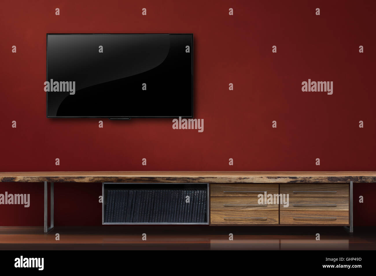 Living room led tv on red wall with wooden table modern loft style Stock Photo