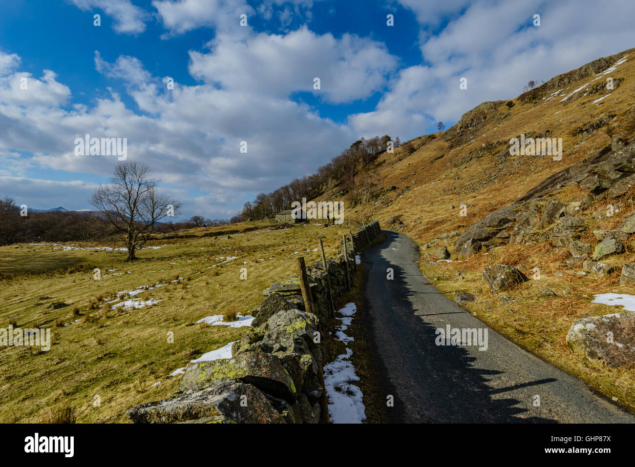 A single-track road from the Borrowdale road (B5289) to Watendlath, in the English Lake District. Stock Photo