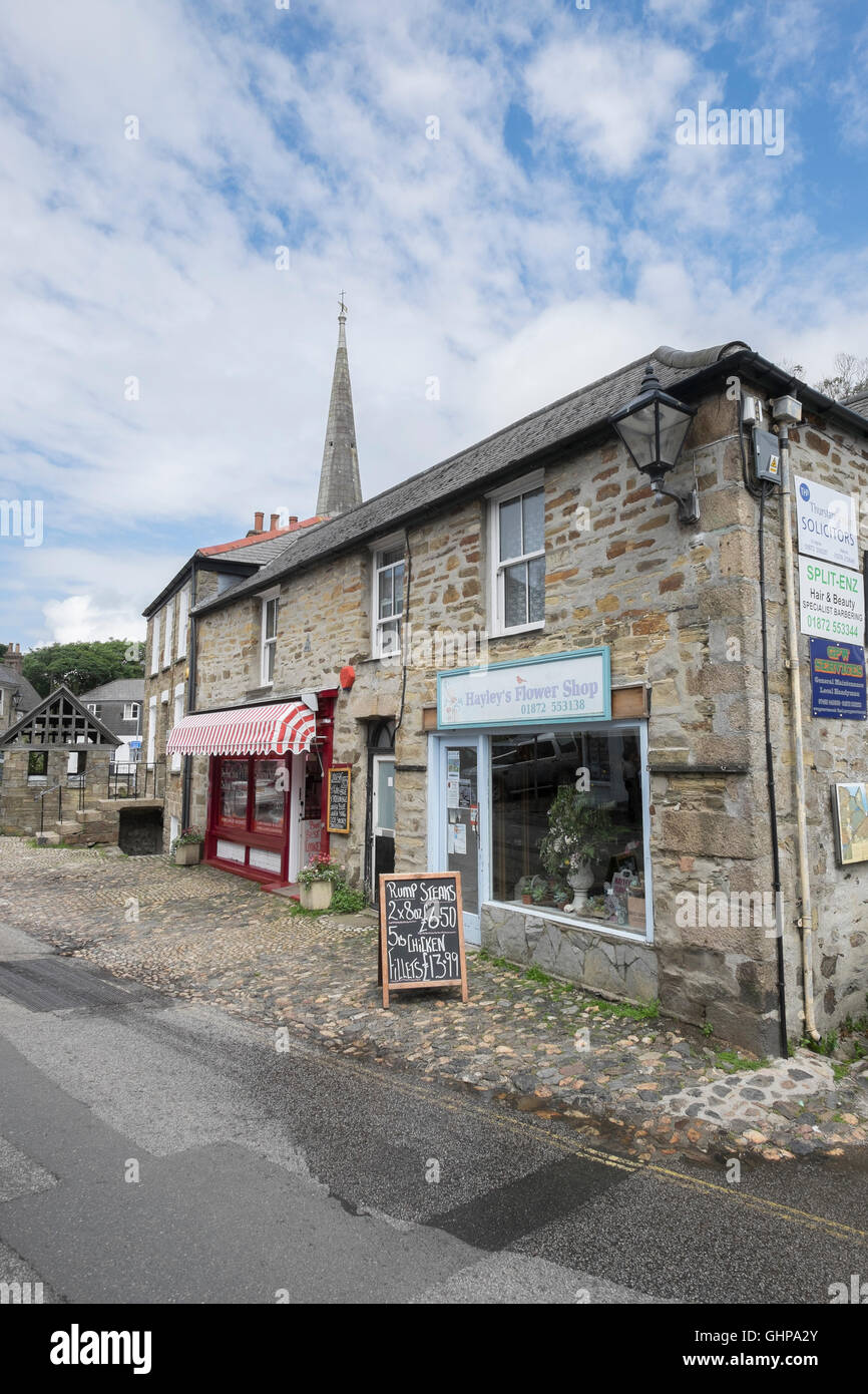 Shops and church in St Agnes village, Cornwall, England, UK Stock Photo