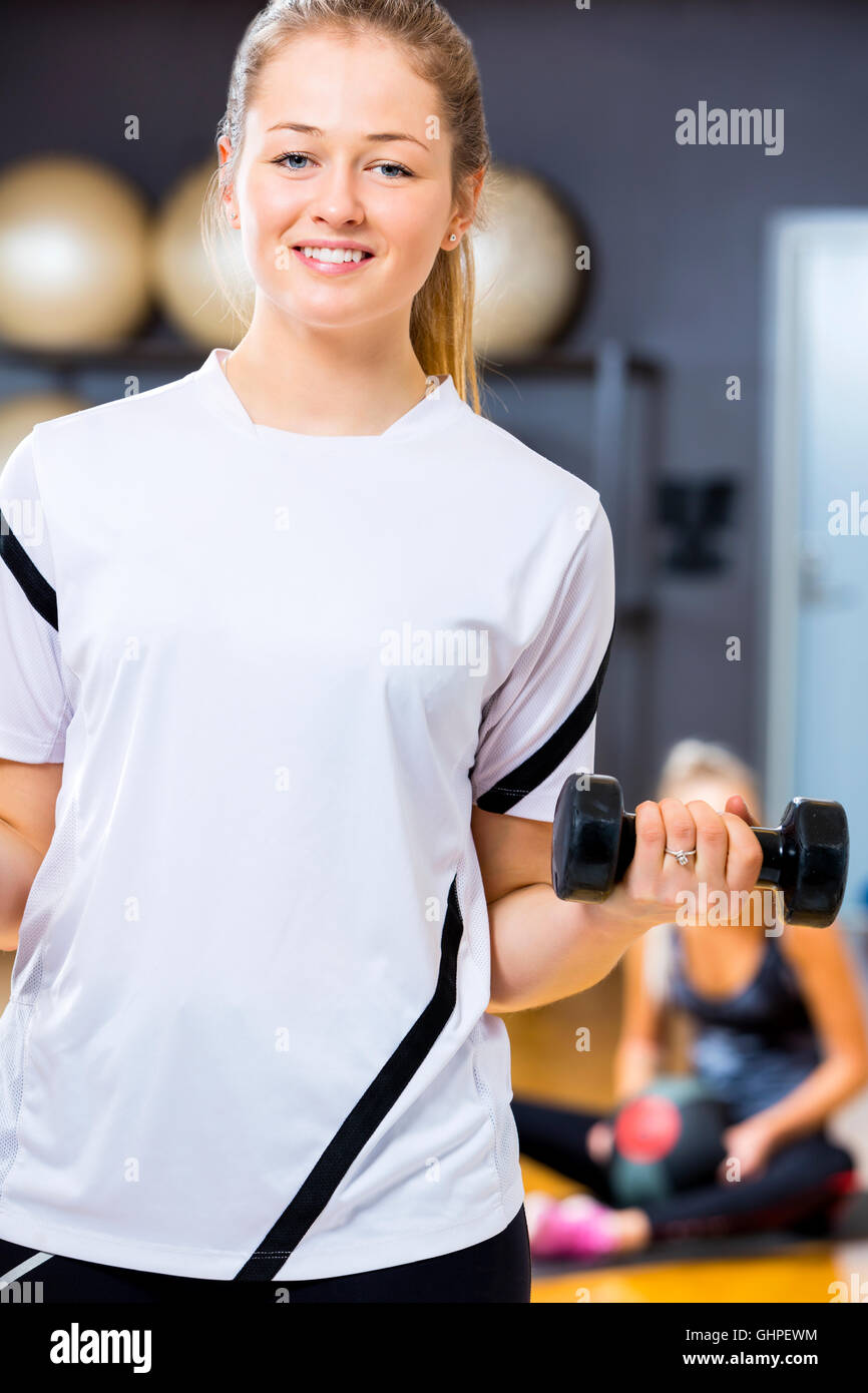 Beautiful healthy happy smiling black asian woman with dumbbell weight  workout and toned body Stock Photo - Alamy