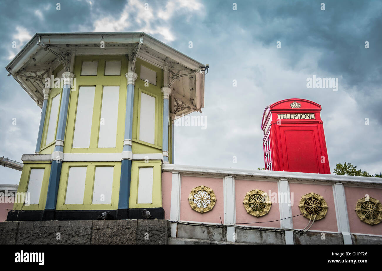 A colourful tollbooth and phone kiosk on the Albert Bridge, Chelsea, London, England, UK Stock Photo