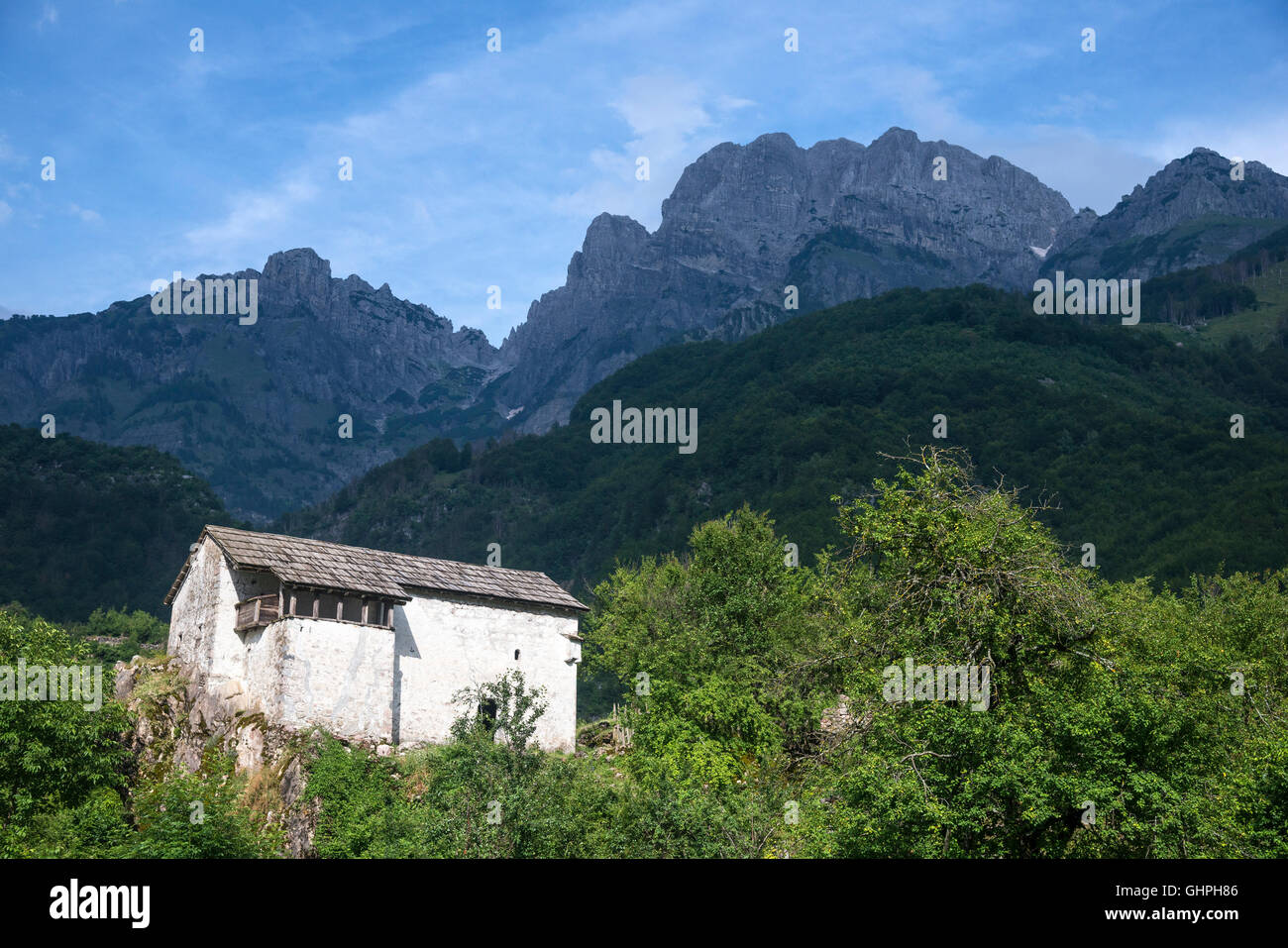 Traditional Ottoman period defensive house now the local Ethnographic Museum at Theth, with the Albanian Alps in the background, Stock Photo