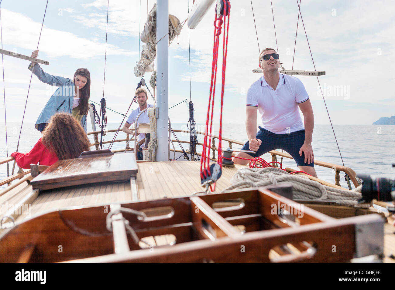 Group of friends on a sailing boat Stock Photo