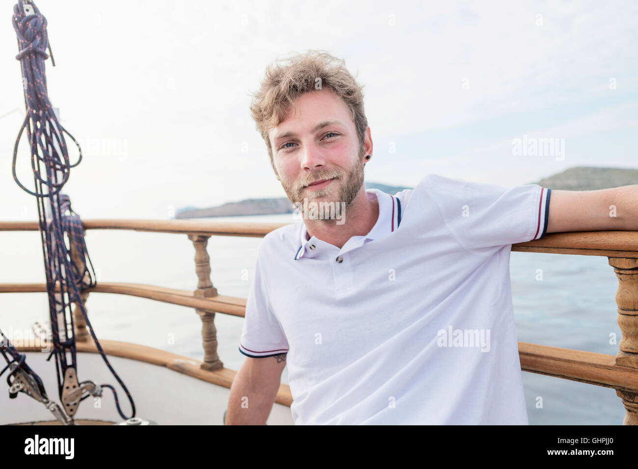 Portrait of man on sailboat Stock Photo