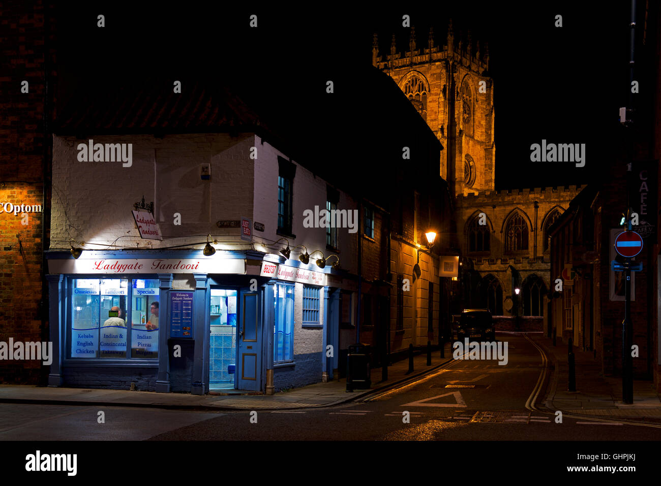 Curry take-away and St Mary's church, at night, Beverley, East Yorkshire, England UK Stock Photo